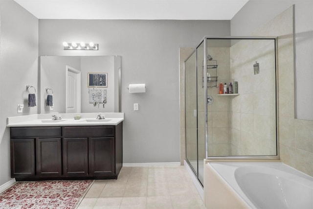 bathroom with plus walk in shower, tile patterned floors, and vanity