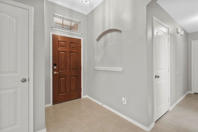 entrance foyer featuring ornamental molding