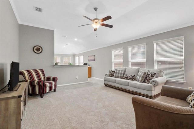 living room featuring ornamental molding, light colored carpet, and ceiling fan