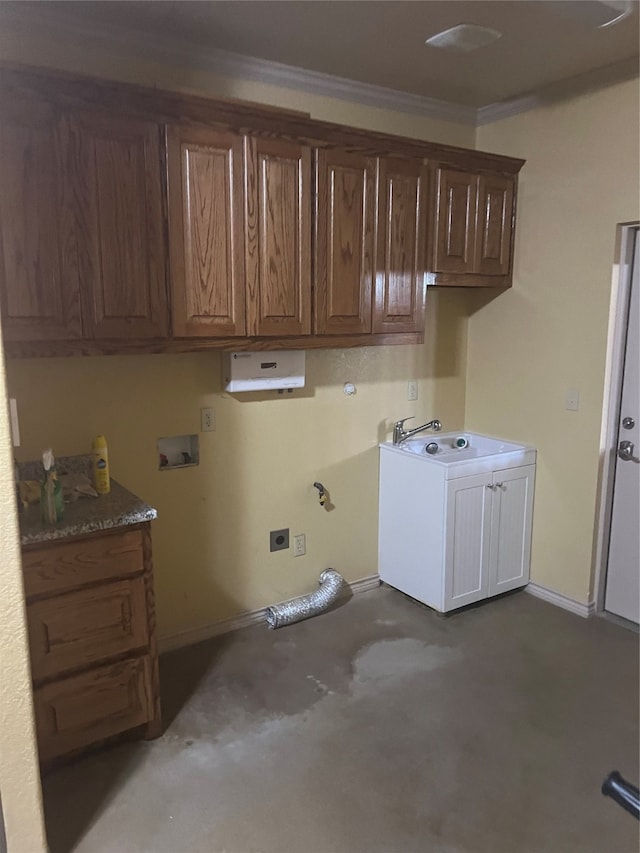 laundry room with hookup for a washing machine, ornamental molding, sink, hookup for an electric dryer, and cabinets