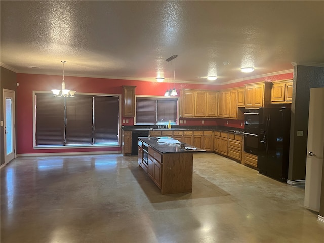 kitchen with pendant lighting, a center island, a textured ceiling, and black appliances