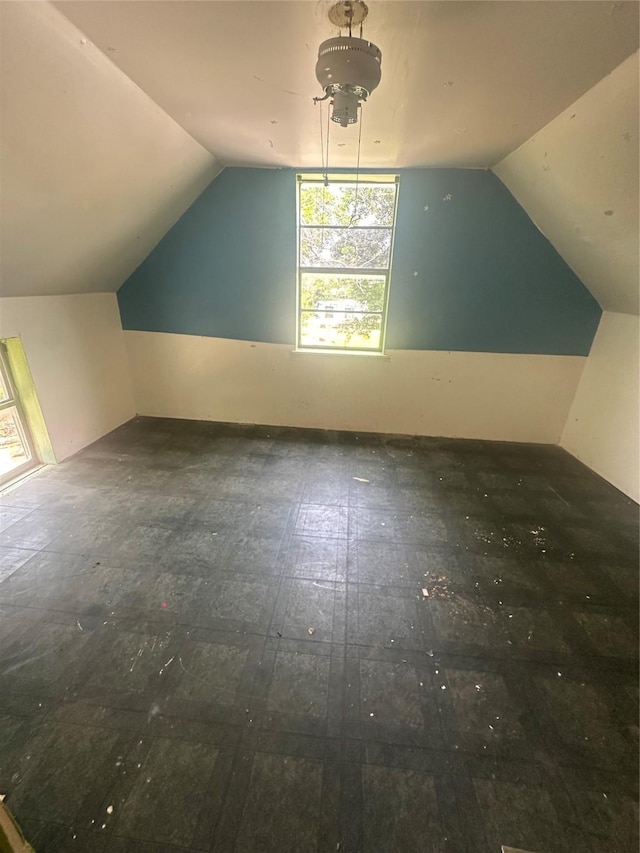 bonus room featuring vaulted ceiling