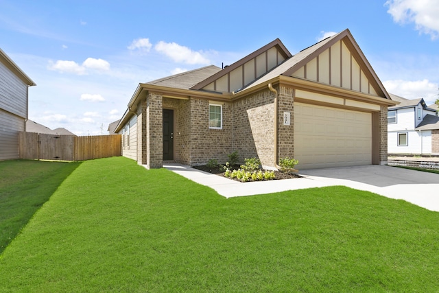 view of front of property featuring a garage and a front lawn