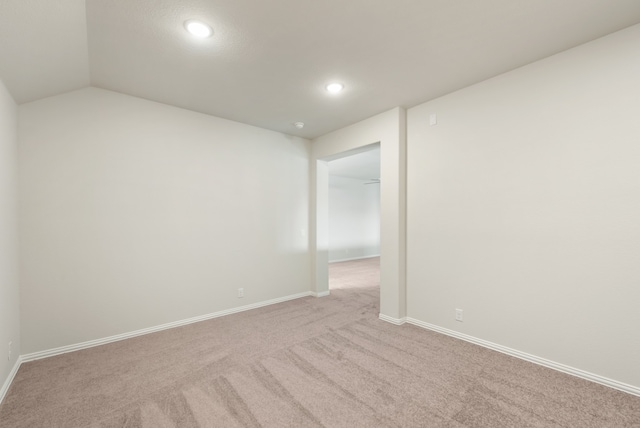 unfurnished room with light colored carpet