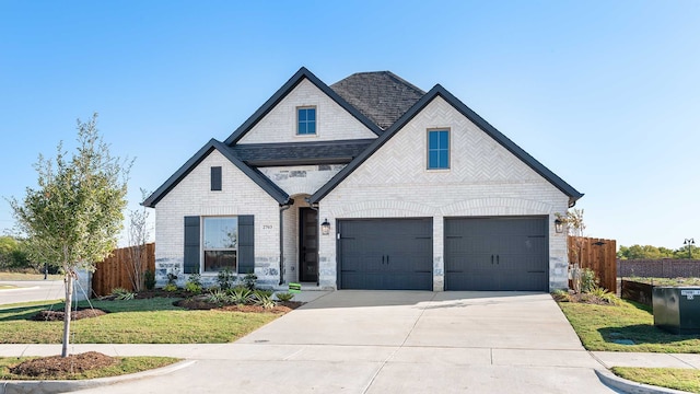 view of front facade featuring a front lawn and a garage