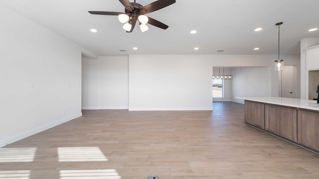 interior space featuring ceiling fan and light hardwood / wood-style flooring