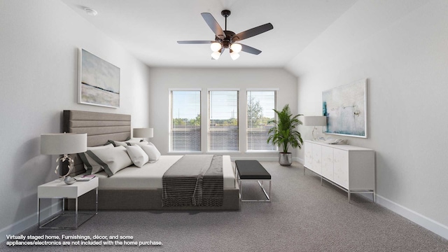 bedroom featuring lofted ceiling, carpet flooring, and ceiling fan