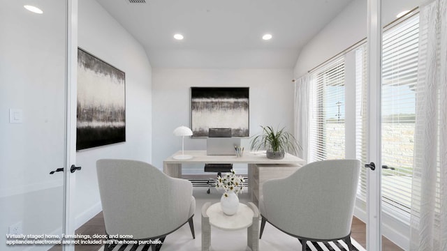 office with french doors, lofted ceiling, and hardwood / wood-style floors