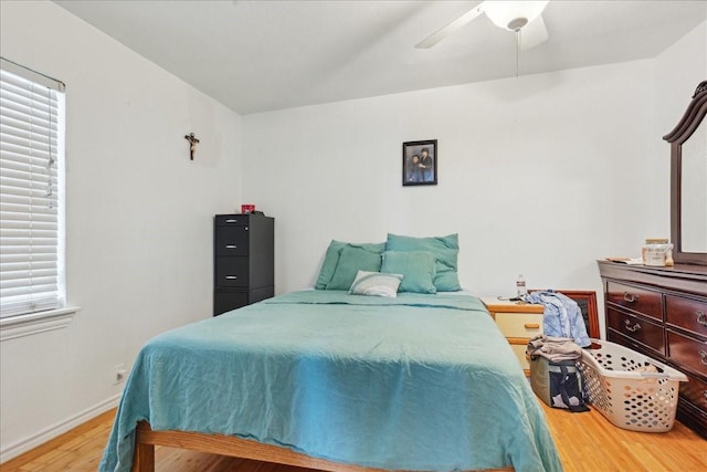 bedroom featuring ceiling fan and hardwood / wood-style flooring