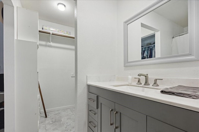 bathroom featuring tile flooring and vanity