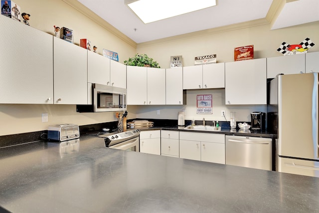 kitchen with appliances with stainless steel finishes, crown molding, sink, and white cabinetry