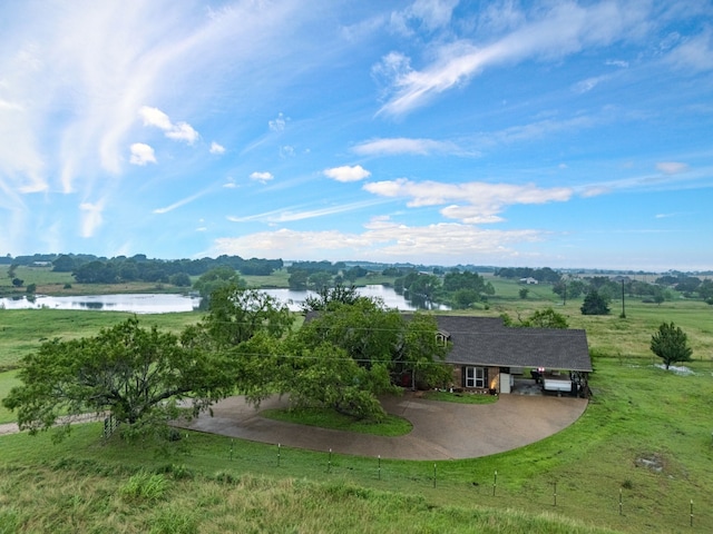 bird's eye view with a water view and a rural view