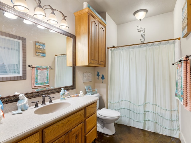 bathroom featuring concrete flooring, vanity, toilet, and curtained shower