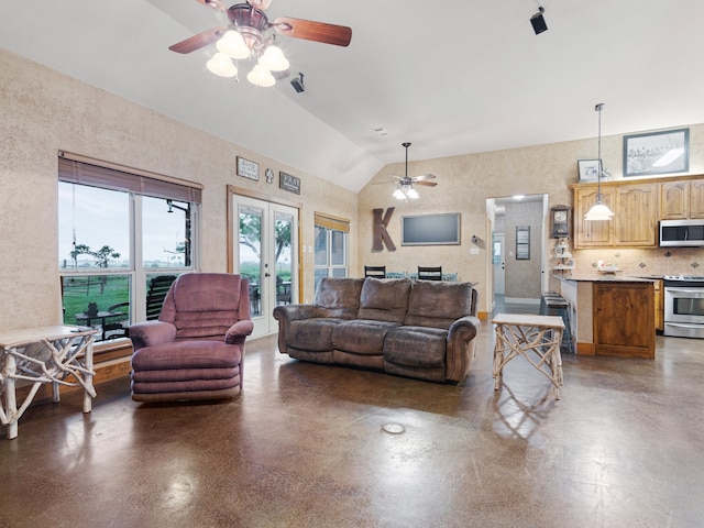 living room featuring ceiling fan, lofted ceiling, and french doors