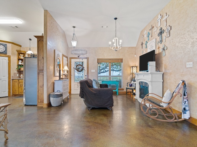 living room with an inviting chandelier and high vaulted ceiling