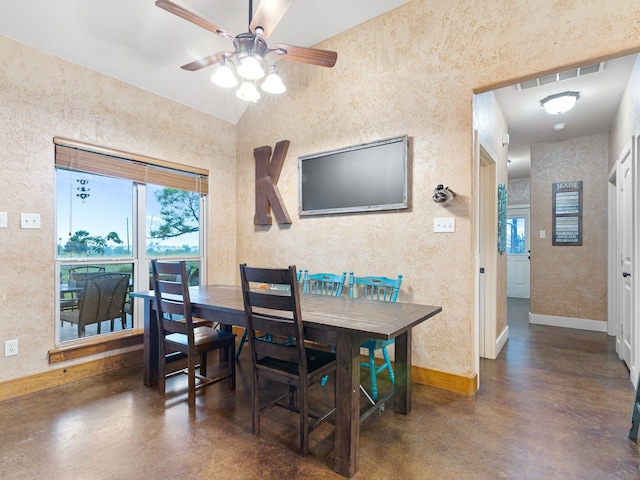 dining room with vaulted ceiling and ceiling fan