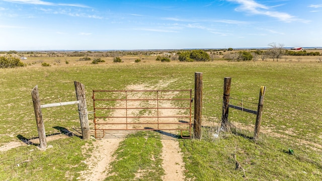 view of gate featuring a rural view