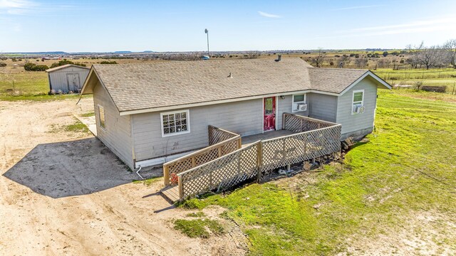 12544 N US Highway 281, Hico, TX 76457 - back of house with a shingled roof and an outdoor structure