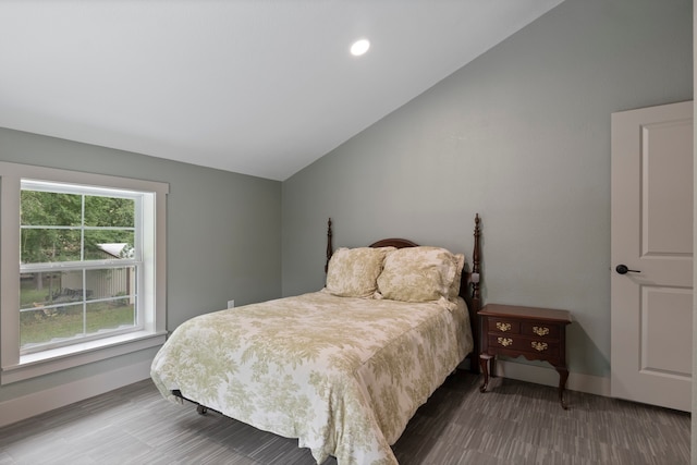 bedroom featuring vaulted ceiling and hardwood / wood-style floors