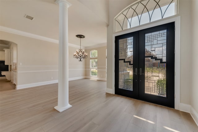 view of front of home with french doors and a front lawn