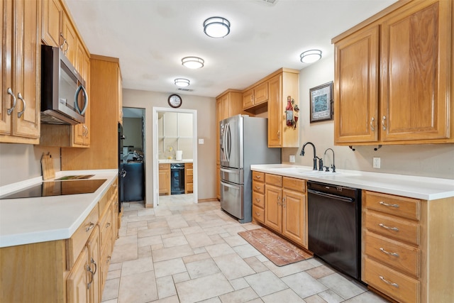 kitchen featuring sink and black appliances