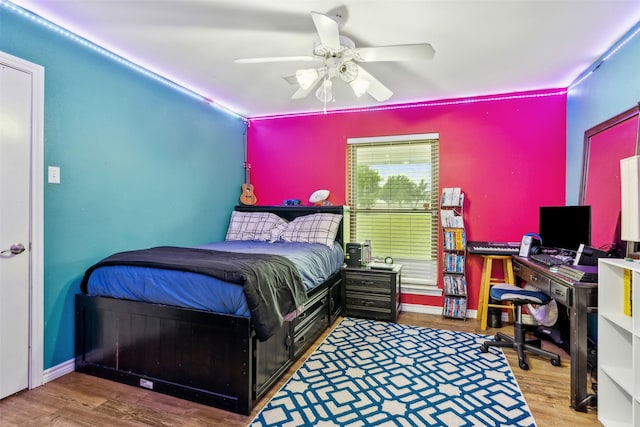 bedroom with ceiling fan and hardwood / wood-style floors