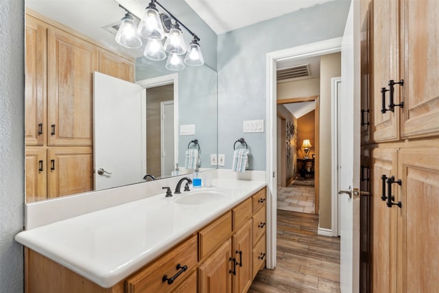 bathroom featuring vanity and wood-type flooring