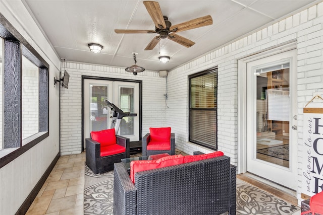 view of patio featuring ceiling fan and a porch