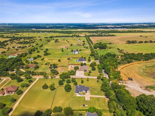 birds eye view of property featuring a rural view