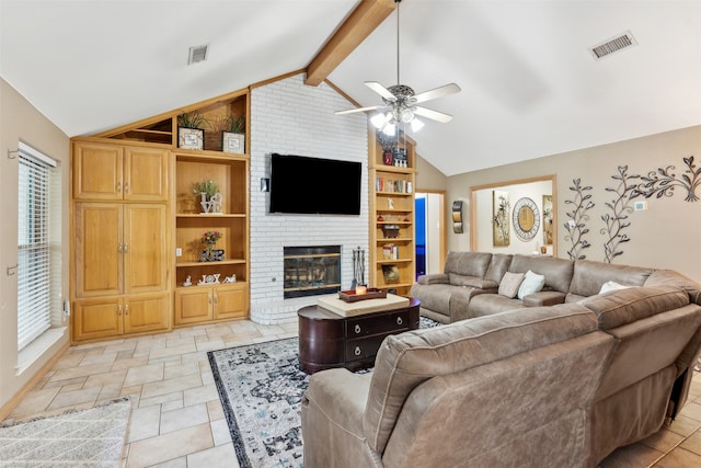 living room featuring vaulted ceiling with beams, ceiling fan, and a fireplace