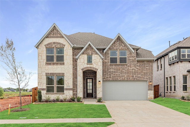 view of front facade with a garage and a front yard