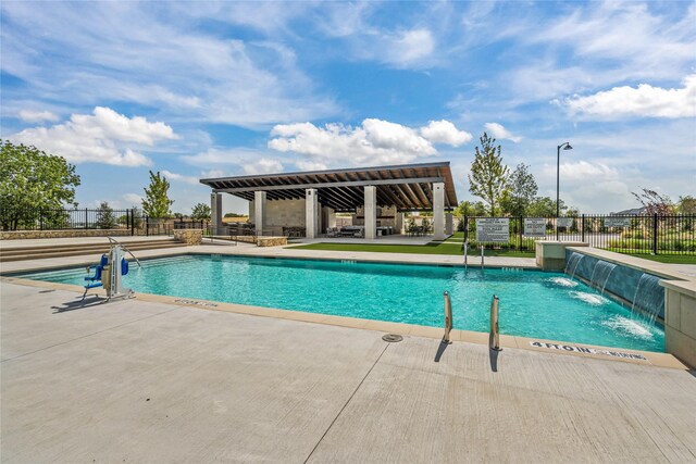 view of patio featuring an outdoor living space with a fireplace