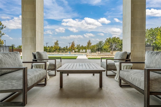 view of patio with a fenced in pool and fence