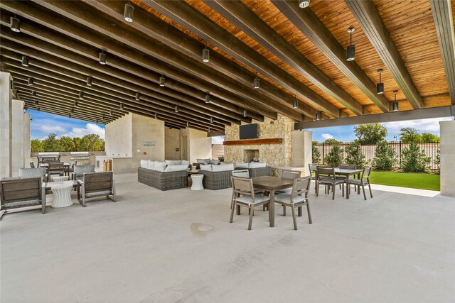 view of patio featuring a community pool and an outdoor living space