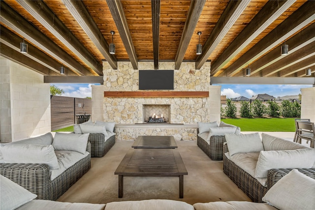 view of patio with a fenced backyard and an outdoor living space with a fireplace