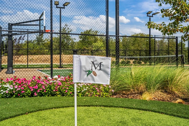 view of basketball court featuring community basketball court and fence