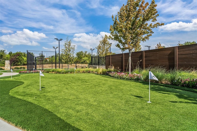 view of home's community with fence