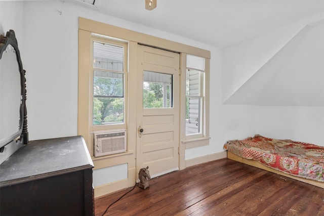 bedroom with dark hardwood / wood-style flooring