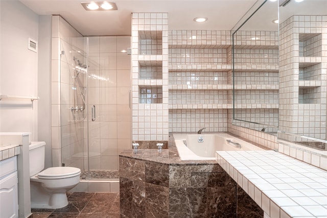 full bathroom featuring independent shower and bath, vanity, and toilet