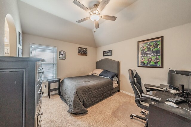 carpeted bedroom with vaulted ceiling and ceiling fan