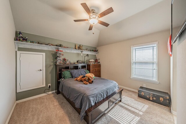 carpeted bedroom featuring ceiling fan and lofted ceiling