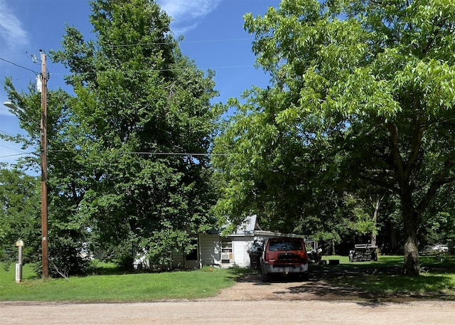 view of property hidden behind natural elements