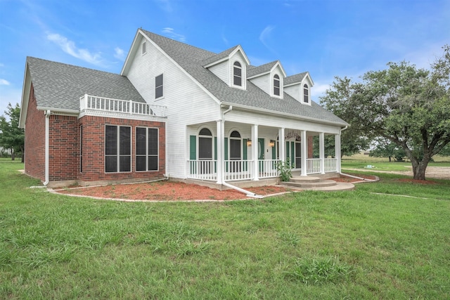 back of house with a yard and a porch