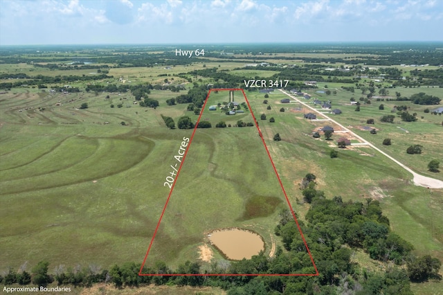 birds eye view of property featuring a rural view