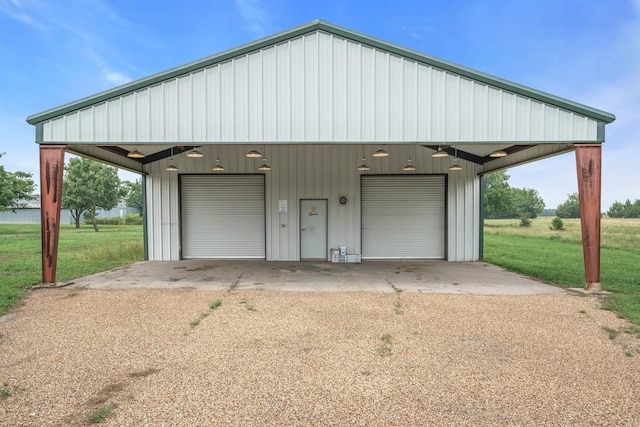 garage featuring a lawn