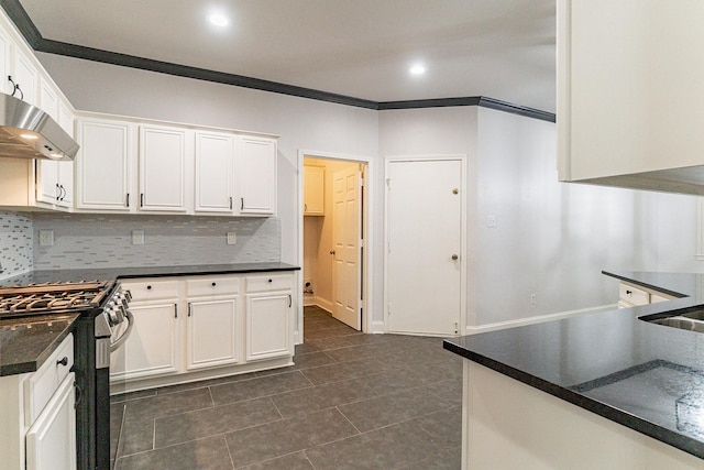 kitchen with white cabinetry, stainless steel gas stove, and range hood