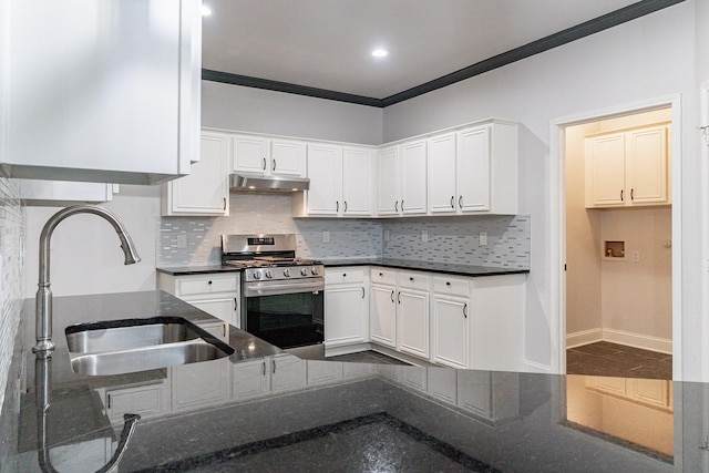 kitchen with stainless steel range with gas cooktop, sink, and white cabinets