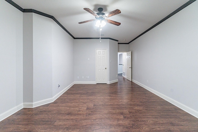 empty room with ceiling fan, dark hardwood / wood-style floors, and ornamental molding