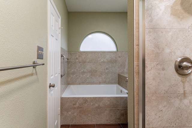 bathroom featuring plus walk in shower