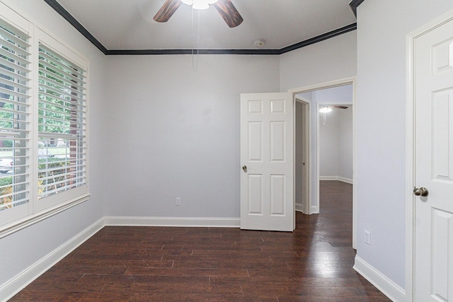 unfurnished room with ceiling fan, dark hardwood / wood-style flooring, and crown molding